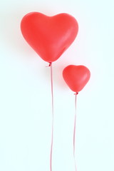Fototapeta na wymiar Red heart shaped balloons
