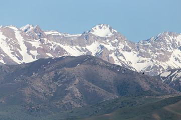 the snowy peaks of the Tien Shan Mountains. Kazakhstan
