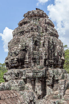 Ruin bayon stone face at gateway of Angkor Wat, Siem Reap, Cambo