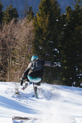 Jumping skier on blue sky background