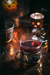 Tea in cup and candles