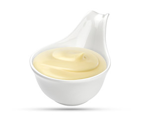 Mayonnaise sauce in bowl isolated on white background with clipping path