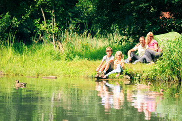 Family of Four having Fun Outdoors in the Summer