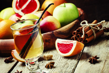 Alcoholic cocktail of hot white wine with vanilla, grapefruit an