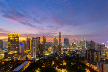 Fototapeta na wymiar Top view of Bangkok modern office buildings, condominium in Bangkok city downtown with sunset sky ,Bangkok is the most populated city in Southeast Asia. Bangkok , Thailand