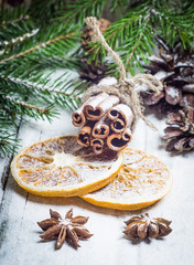 Obraz na płótnie Canvas Christmas composition with anise stars, pine cones and dried orange