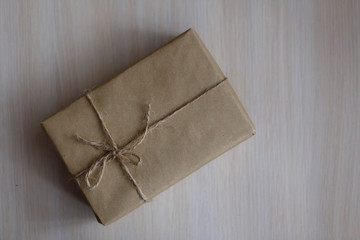 Vintage Brown gift box on wooden background - vintage filter processing