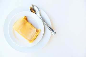 milk pudding on white plate. Top view