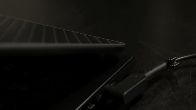 Closing the top cover of the laptop