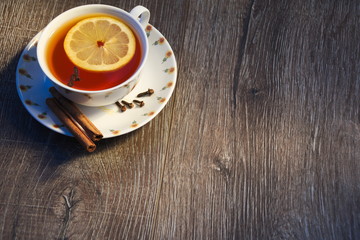 A cup of tea with lemon and cloves