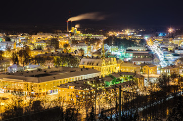Fototapeta na wymiar View of small swedish european town Soderhamn at night, industrial background with evening illumination