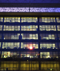Obraz premium Lights on the windows of an office building at night