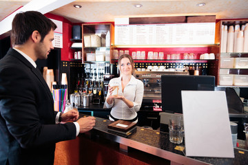 Friendly Bartender At A Cafe