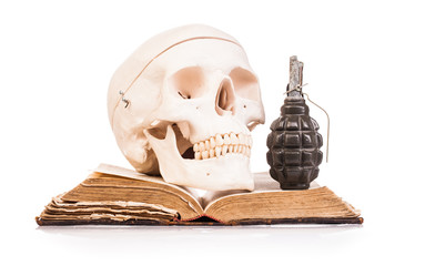 holy book and human scull  isolated on white