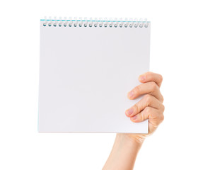 hand holding blank notebook