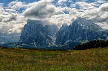 View of the Sassolungo (Langkofel) and Sassopiatto Group of the Italian Dolomites from Alpe di Siusi in Val Gardena.