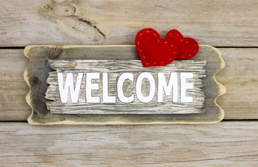 Welcome sign with red hearts