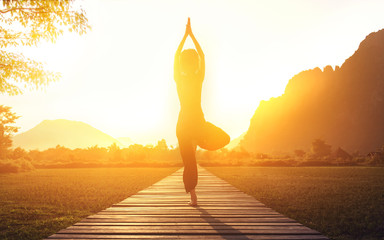 serenity and yoga practicing at sunset, meditation