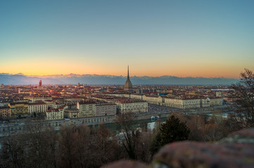 Fototapeta na wymiar panorama of the city of turin from above at sunset with mole Antonelliana