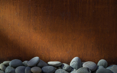 Fototapeta na wymiar Copper zen river rock background.
