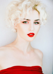 portrait of a beautiful blond woman with red lips