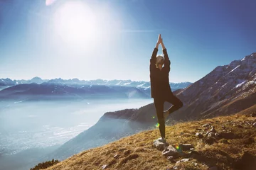 Foto op Canvas Yoga in the mountains tree pose © Kateryna