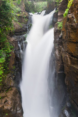 Portrait of high waterfall as part of the Iguazu Waterfall with long exposure