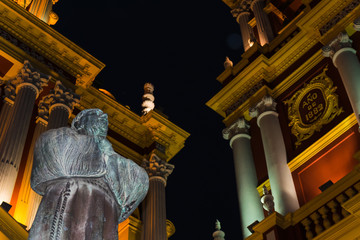 Closeup of Francisco in front of the illuminated San Francisco Church in Salta, Argentina at night