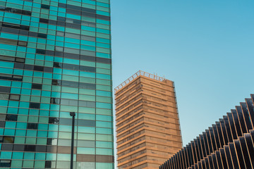 Fototapeta premium Large medium and small buildings in urban setting