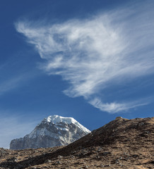 The mountains peak Gyachung Kang with beautiful clouds - Gokyo region, Nepal, Himalayas
