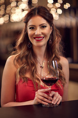 Woman with glass of red wine