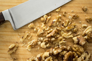 Fototapeta na wymiar Chopping walnuts, close up