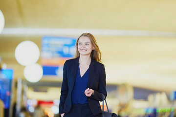Young business woman in international airport