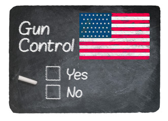 Gun Control choice using chalk on slate blackboard