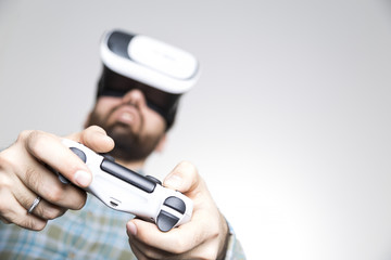 Man's hands with controller and vr glasses