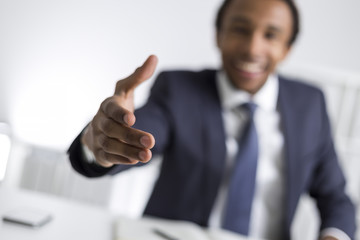 Blurred African American man stretching hand