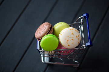 A batch of coloroful French macaroons on a table