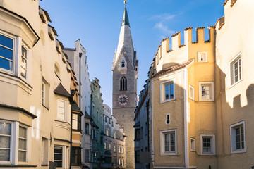 Bressanone downtown with buildings and White Tower.