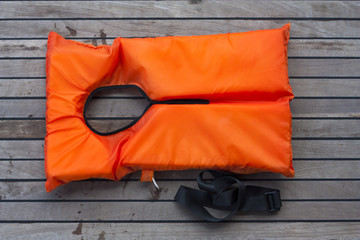 Orange life jacket.