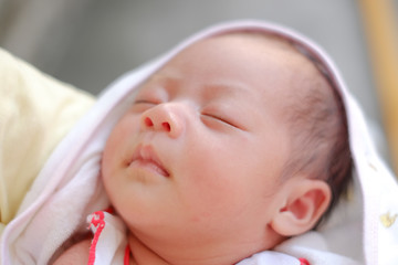 Newborn Asian baby girl sleeping