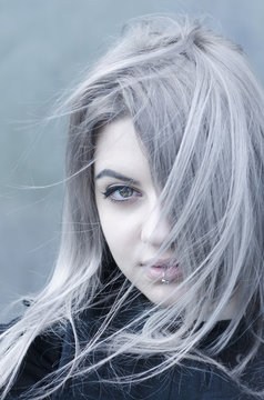 Young grey haired girl portrait in the wind