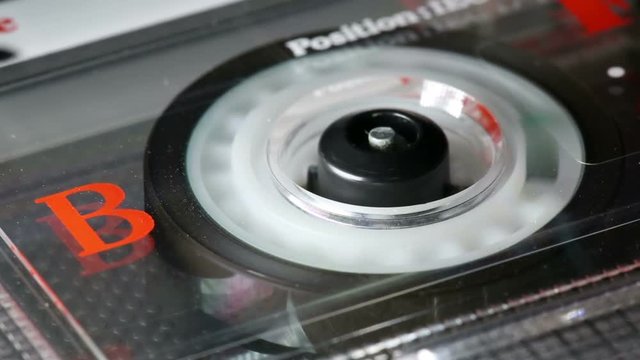 Retro used analogue audio tape in tape deck playing