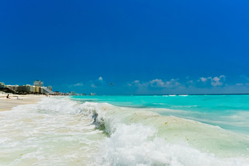 Fototapeta na wymiar Cancun's blue sea and white waves (horizontal)