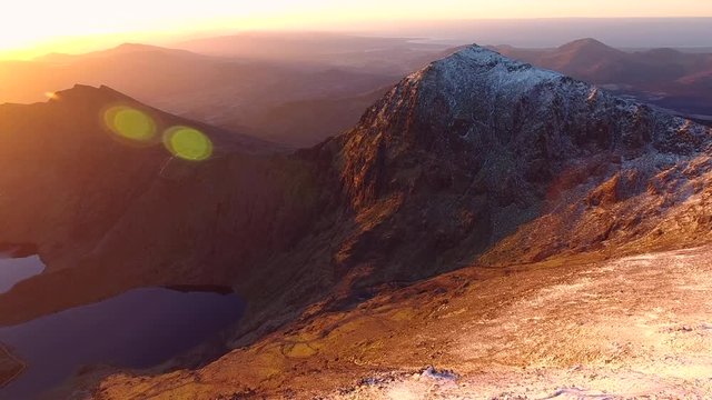Aerial view of Mount Snowdon at sunrise, from high over Crib Goch.