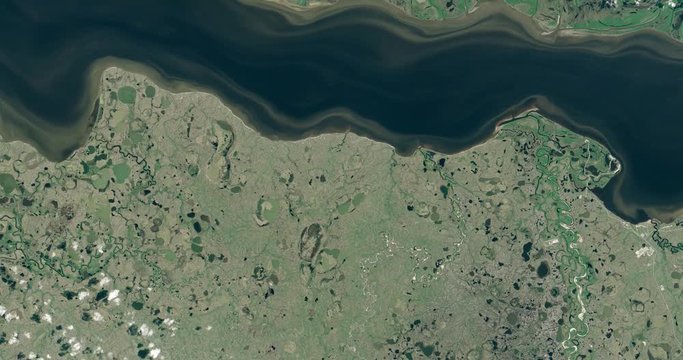 High-altitude overflight aerial of the Taz River, western Siberia, Russia. Clip loops and is reversible. Elements of this image furnished by USGS/NASA Landsat