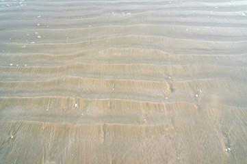 Beach sand pattern on the sand dunes in the beach of thailand