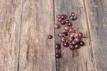 Grape red fresh Select focus with shallow depth of field on wooden table background