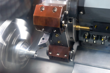 Fototapeta premium Steel metal automotive parts cutting machine process by CNC lath