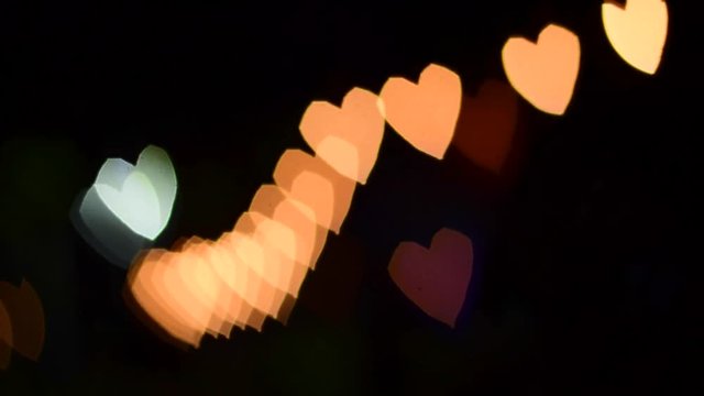 Nong Prajak Public Park Udon Thani, Thailand Heart bokeh. LED flowers colorful illuminated plastic optical fibers in dark back.
