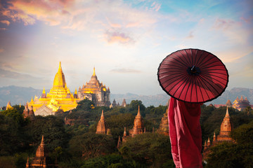Monk standing with holding umbrella, Bagan Mandalay Myanmar - 132558533